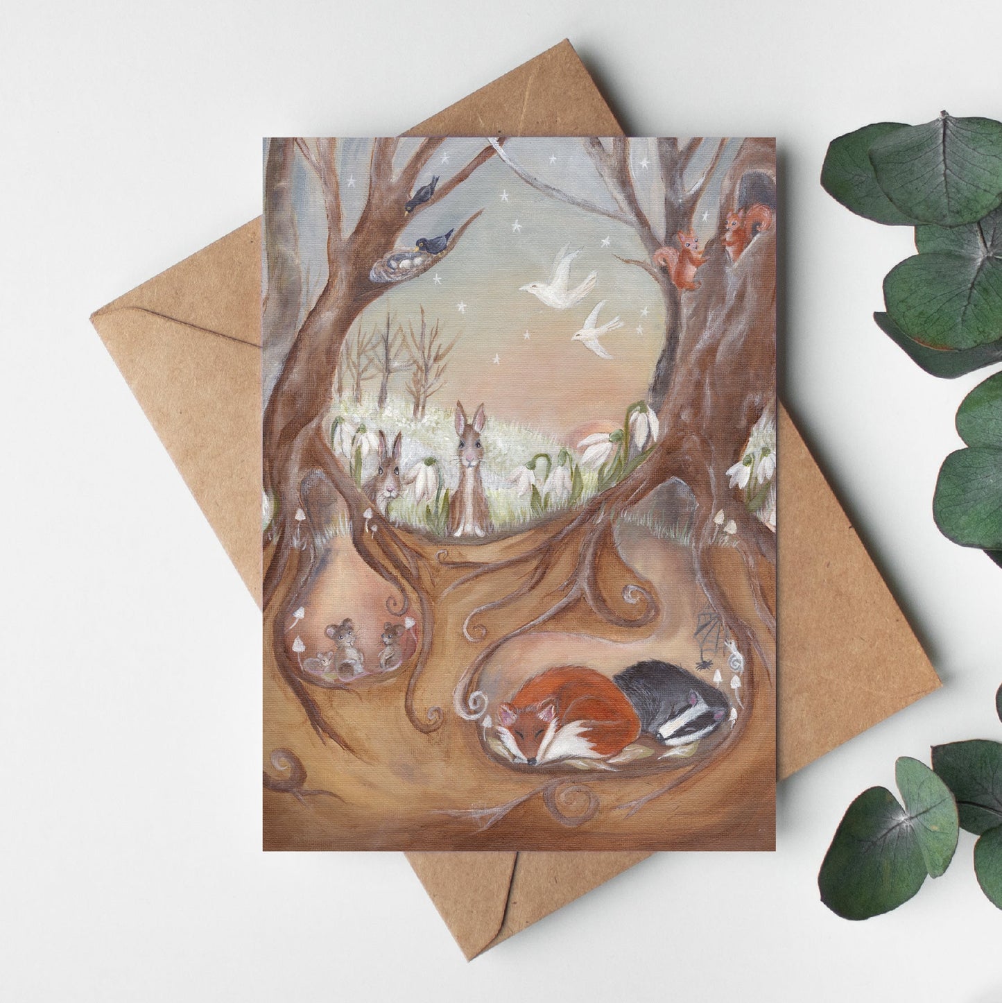 Greeting card with nature-themed illustration and envelope on a white background