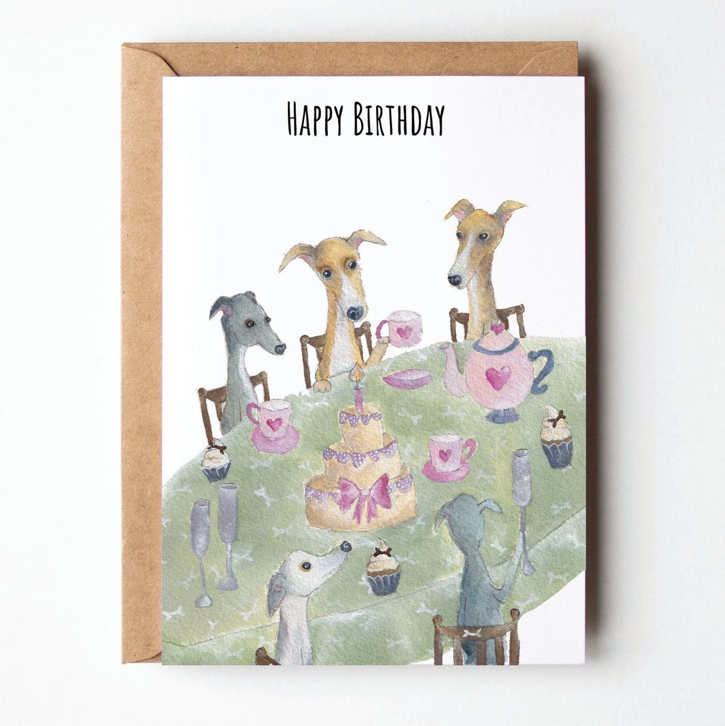Birthday card with illustrations of dogs at a tea party on a white background