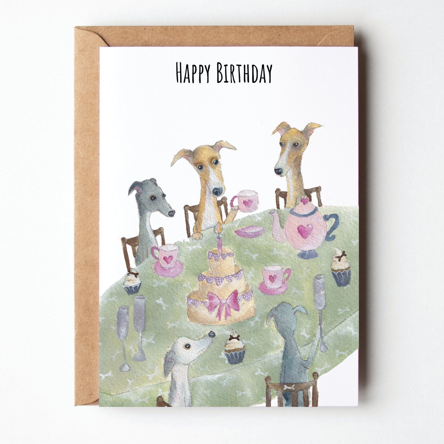 Birthday card with illustrations of dogs at a tea party on a white background