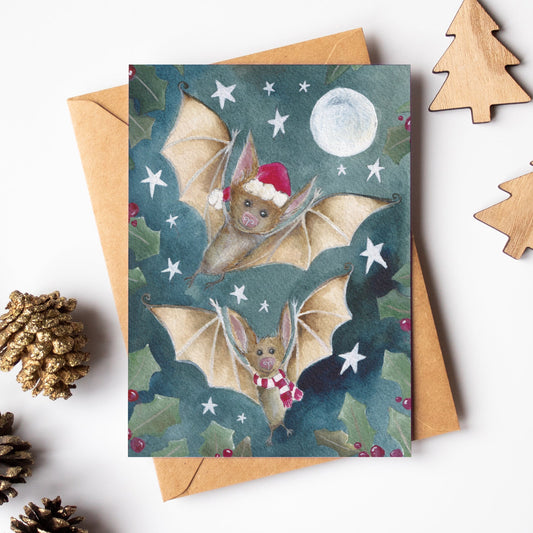 Christmas card with bat illustration on a white background with decorative items.
