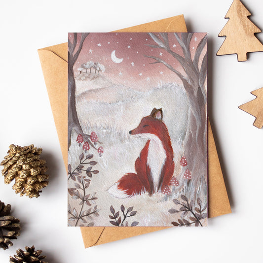 Greeting card with a fox illustration on a white background with decorative elements.
